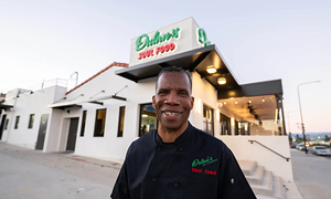Greg Dulan standing in front of Dulan's on Crenshaw