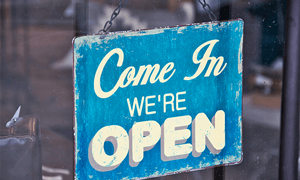 Blue and White Come in We're Open Signboard