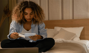 Photo of a Woman Reading a Letter