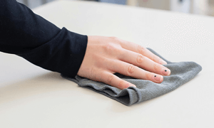 A Person Wiping a Table