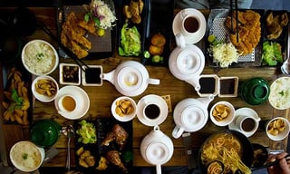 Table top with food and tea.