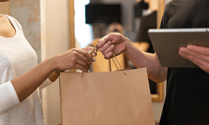 Restaurant Worker handing food to customer